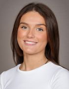 en person som smiler til kameraet